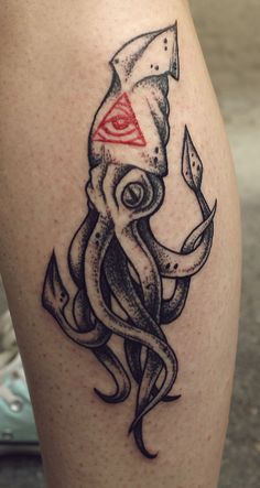 Black octopus tattoo with red triangle