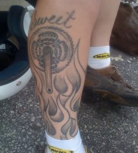 Black pretty bicycle tattoo on leg