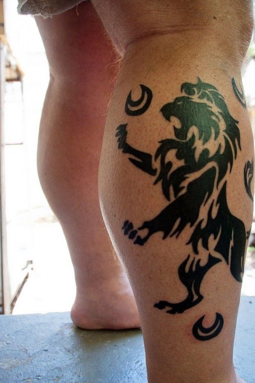 Black pretty lion tattoo on leg
