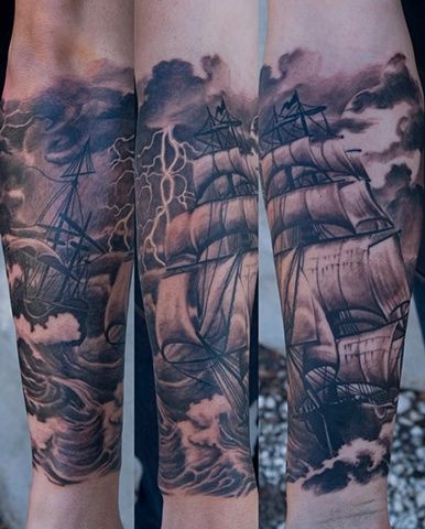 Black pretty ship tattoo on arm