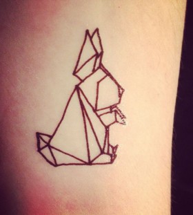 Black rabbit origami tattoo on arm