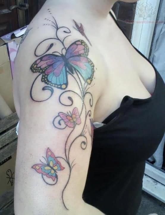 Black shoulder butterfly tattoo on arm