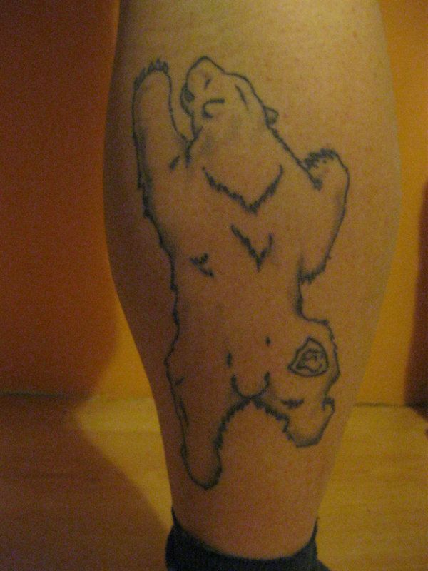 Black simple bear tattoo on leg