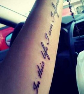 Black simple quote tattoo on arm