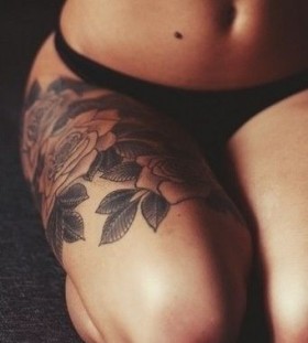 Black simple rose tattoo on leg