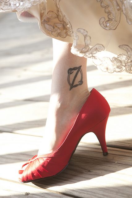 Black simple tattoo with shoes