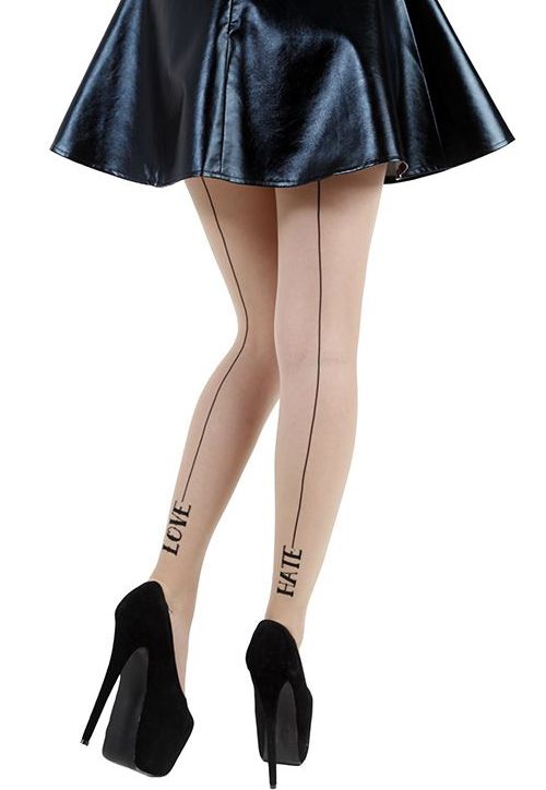 Black skirt and quote tattoo on leg
