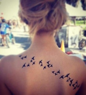 Black women bird tattoo on shoulder