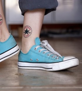 Blue and black tattoo with shoes