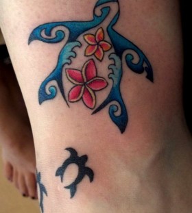 Blue and red hawaiian style tattoo