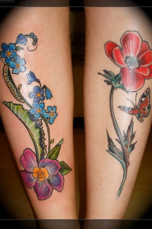 Blue and red poppy tattoo on leg