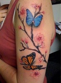 Blue and yellow butterfly tattoo on arm