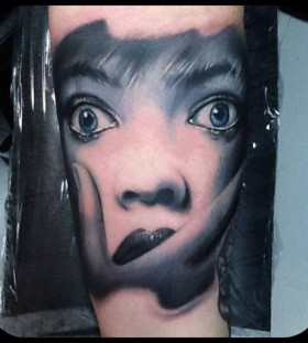 Blue hair face tattoo on arm