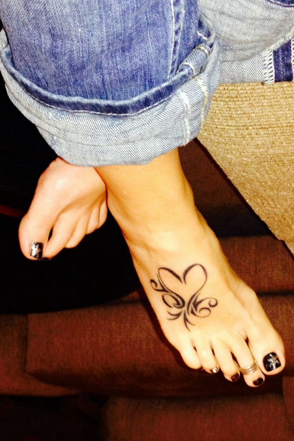 Blue jeans and heart tattoo