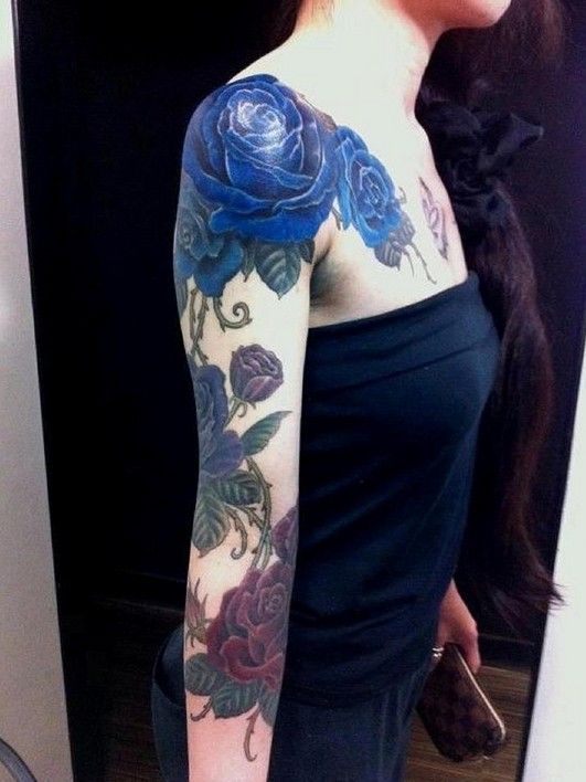 Blue lovely rose tattoo on arm