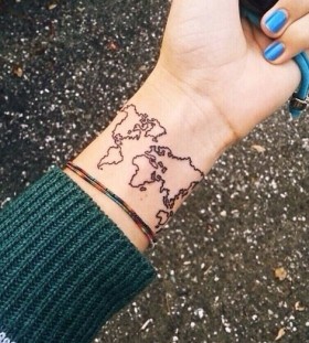 Blue nails and map tattoo on arm