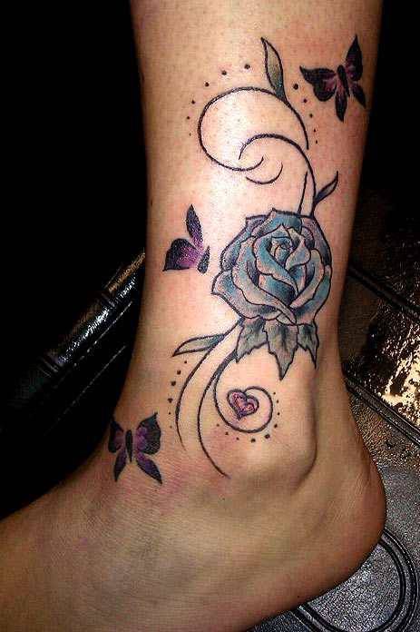 Blue rose and butterfly tattoo on leg