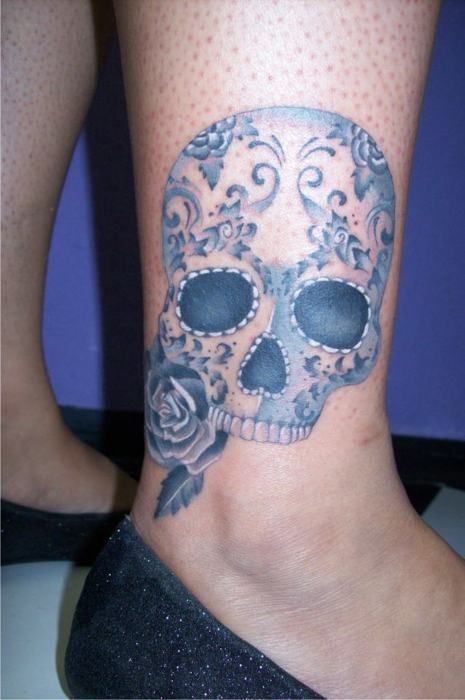 Blue skulls ornaments tattoo