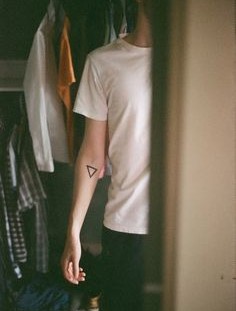 Boy with triangle tattoo
