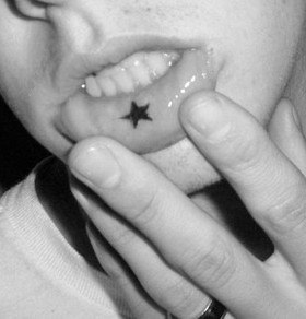 Boy's star lips tattoo