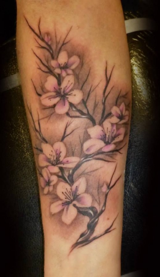 Brown and black cherry tattoo on arm