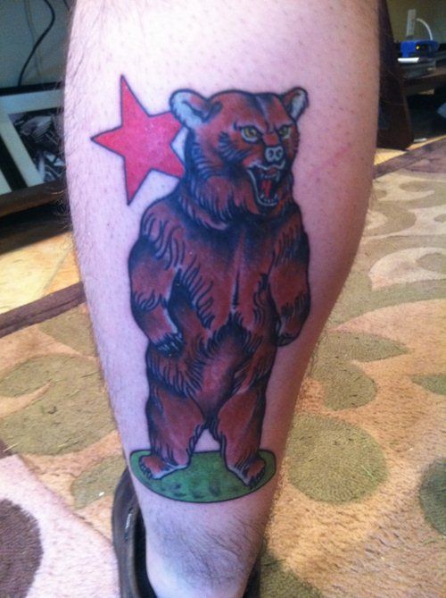 Brown bear and red star tattoo