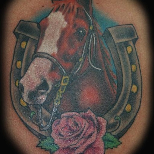 Brown horse with horse shoe tattoo