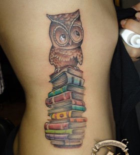 Brown owl and back book tattoo