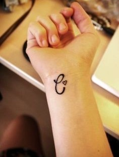 C letter tattoo on hand