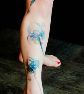 Calf watercolor poppy tattoo on leg