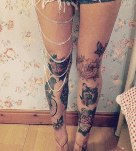 Cat and bike butterfly tattoo on leg