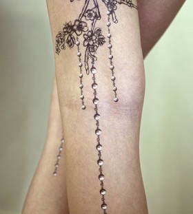 Chanel style crystal tattoo on leg