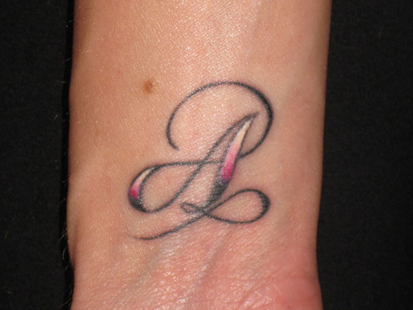Colorful A letter tattoo on wrist