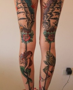 Colorful fish and girl ship tattoo on leg