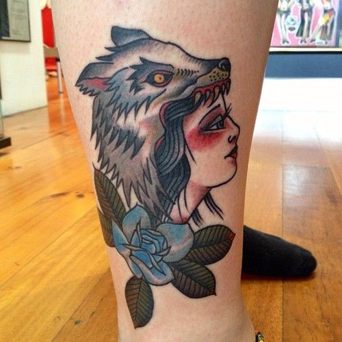 Colorful girl wolf tattoo on leg