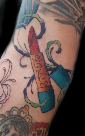 Colorful lipstick lips tattoo on arm