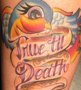 Colorful parrot and quote tattoo on leg