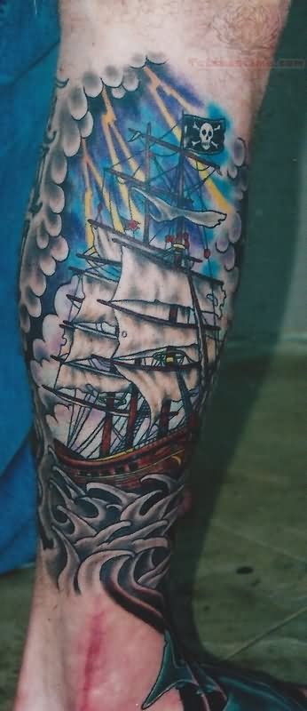 Colorful pirate ship tattoo on leg