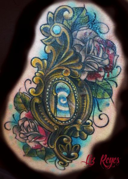 Colorful rose and keyhole tattoo