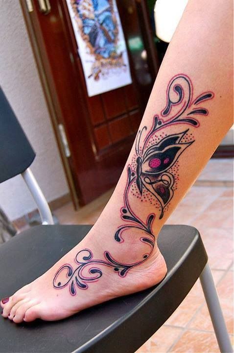 Colorful simple butterfly tattoo on leg