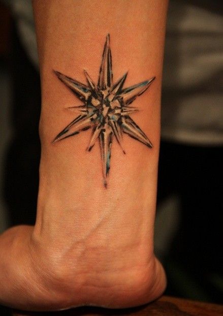 Colorful simple moon tattoo on arm