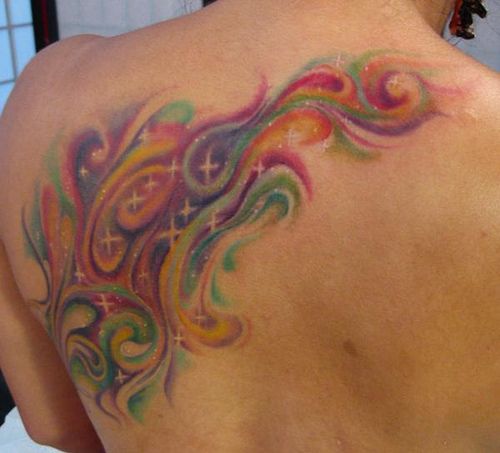 Colorful women back star tattoo on shoulder