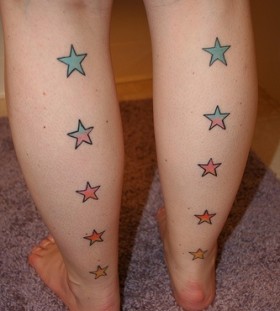 Colorful women star tattoo on leg