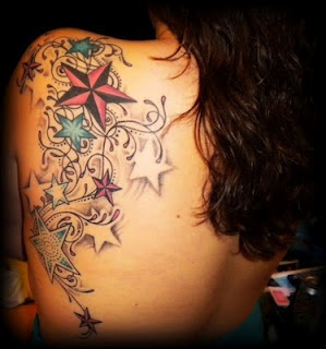 Colorful women stars tattoo on shoulder