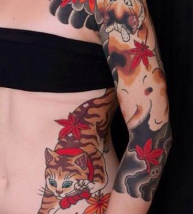 Colorful women's cat tattoo on arm