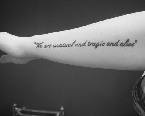 Cool black and white quote tattoo on arm