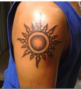 Cool men's sun tattoo on shoulder