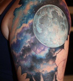 Cosmic colors moon tattoo on shoulder
