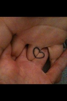 Couple fingers heart tattoo