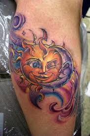 Creapy moon and sun tattoo on leg